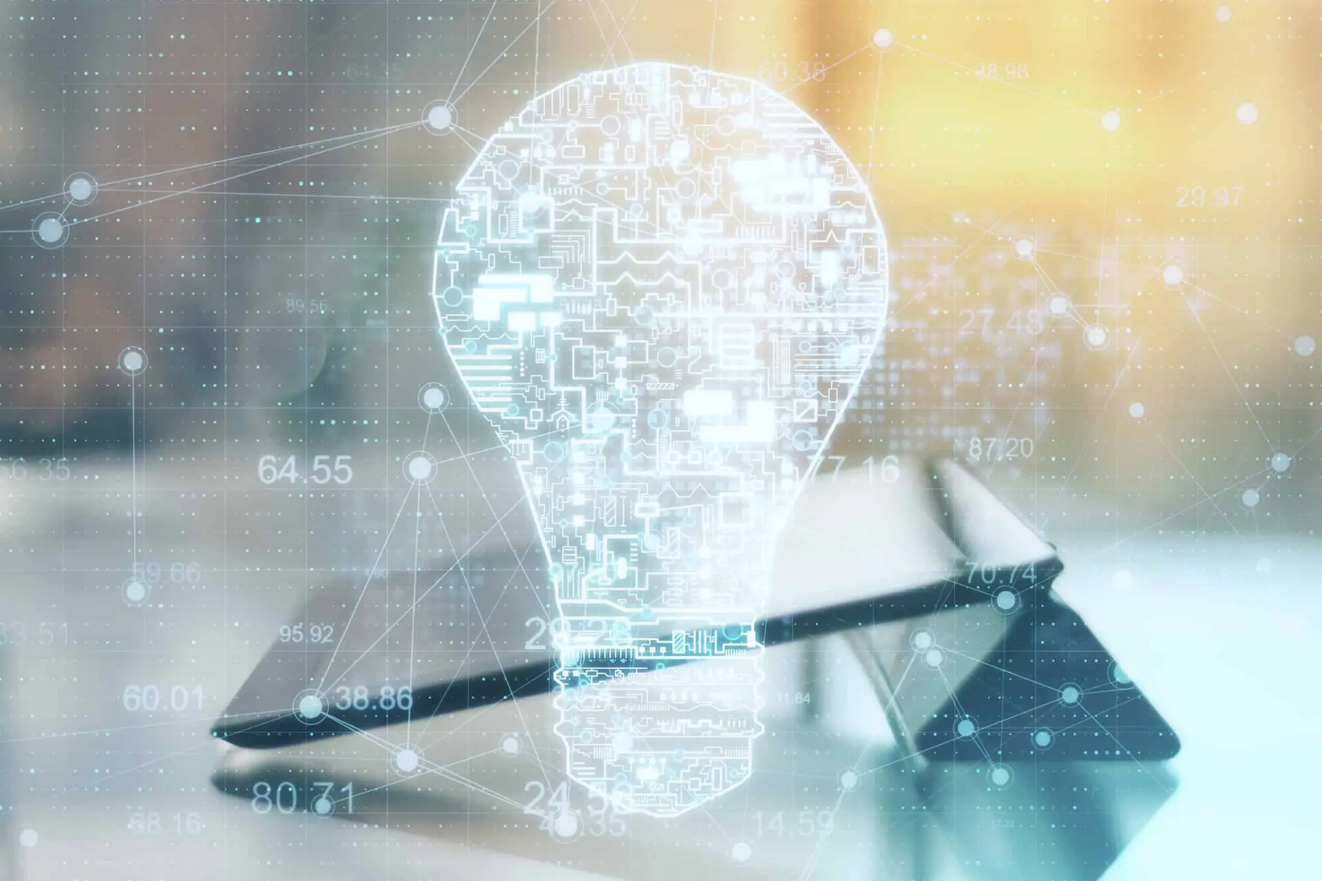Digital lightbulb representing innovation and technology with a tablet device.